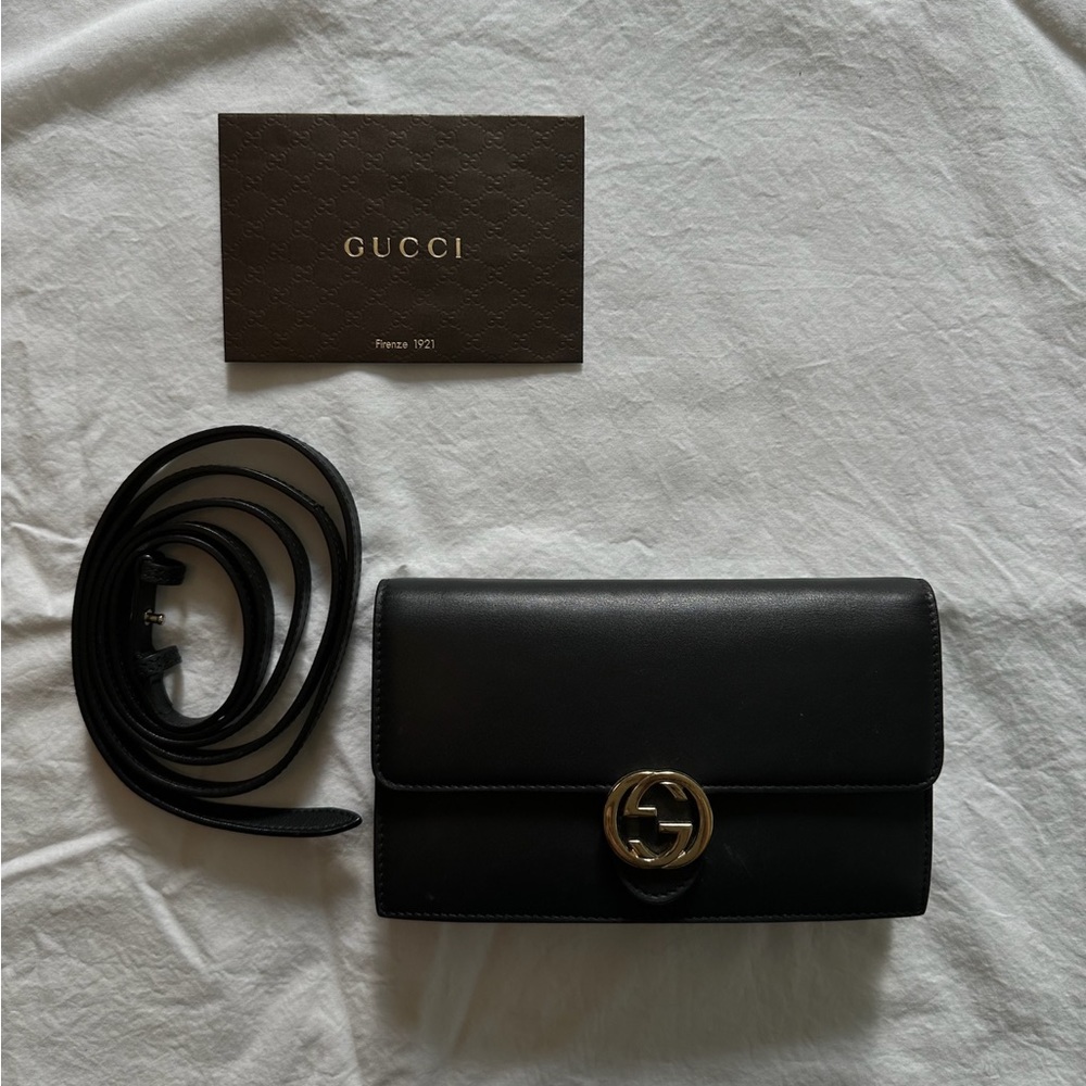 Gucci black clutch with optional strap. Gold detail. Gucci box and bag included.